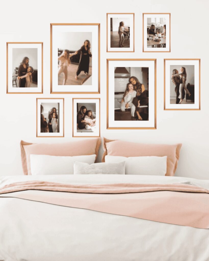 Gallery wall featuring family photography by D. Layne Photography in Murfreesboro, TN, showcasing framed portraits arranged stylishly