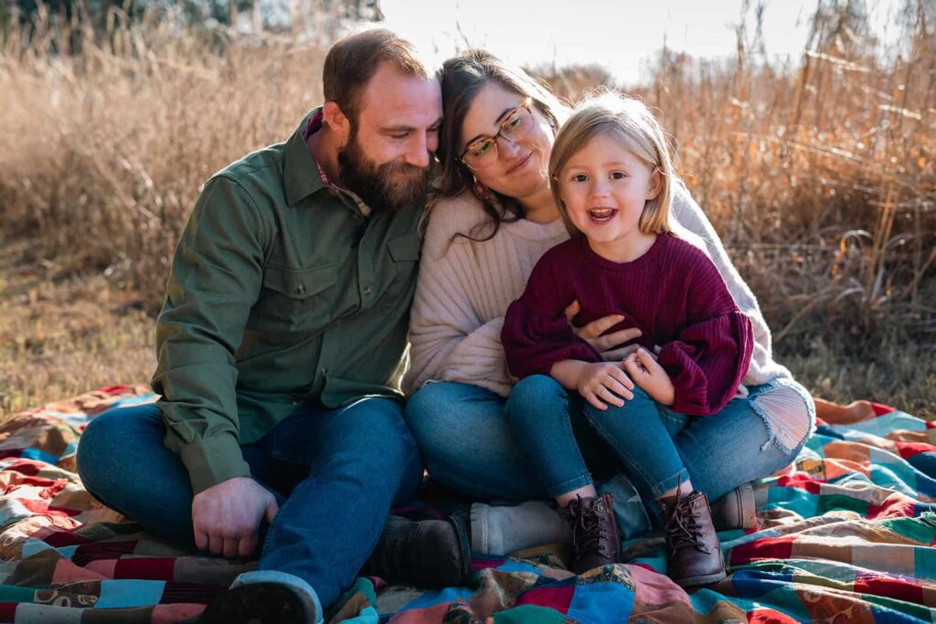 Happy family enjoying an outdoor photography session