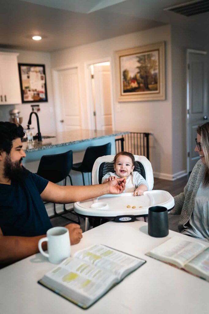 Family posing and connecting during an indoor photography session in Murfreesboro, TN