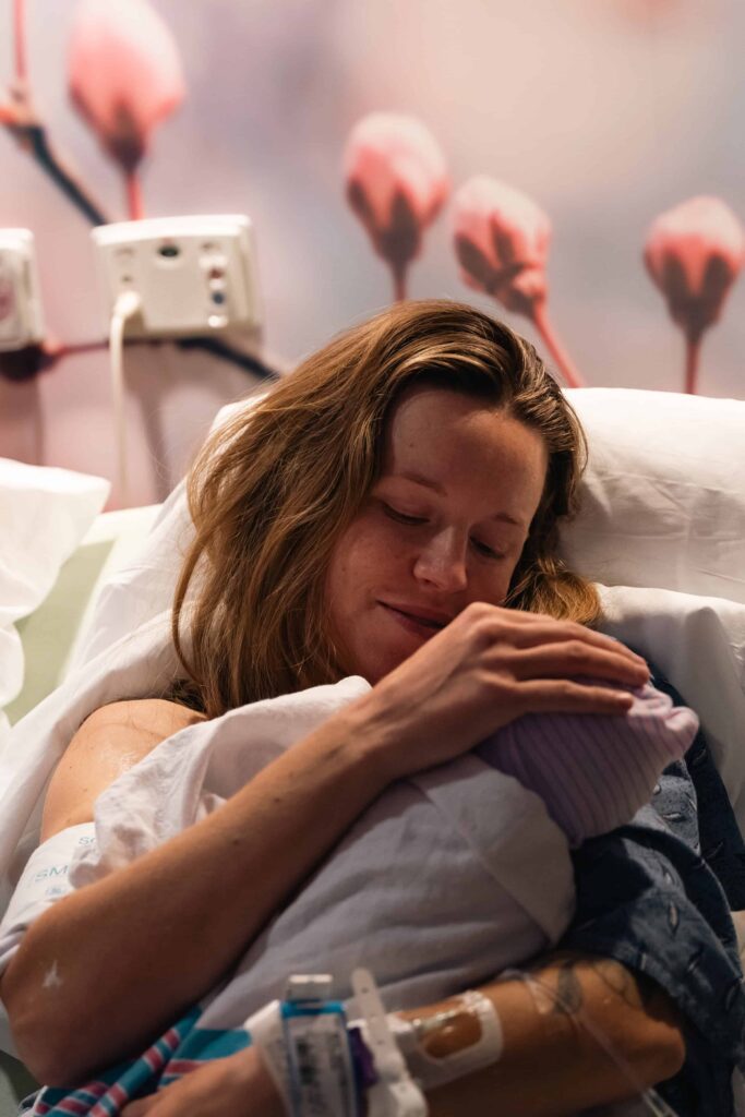 Birth photography session in Rutherford County, TN, capturing a mom holding her baby